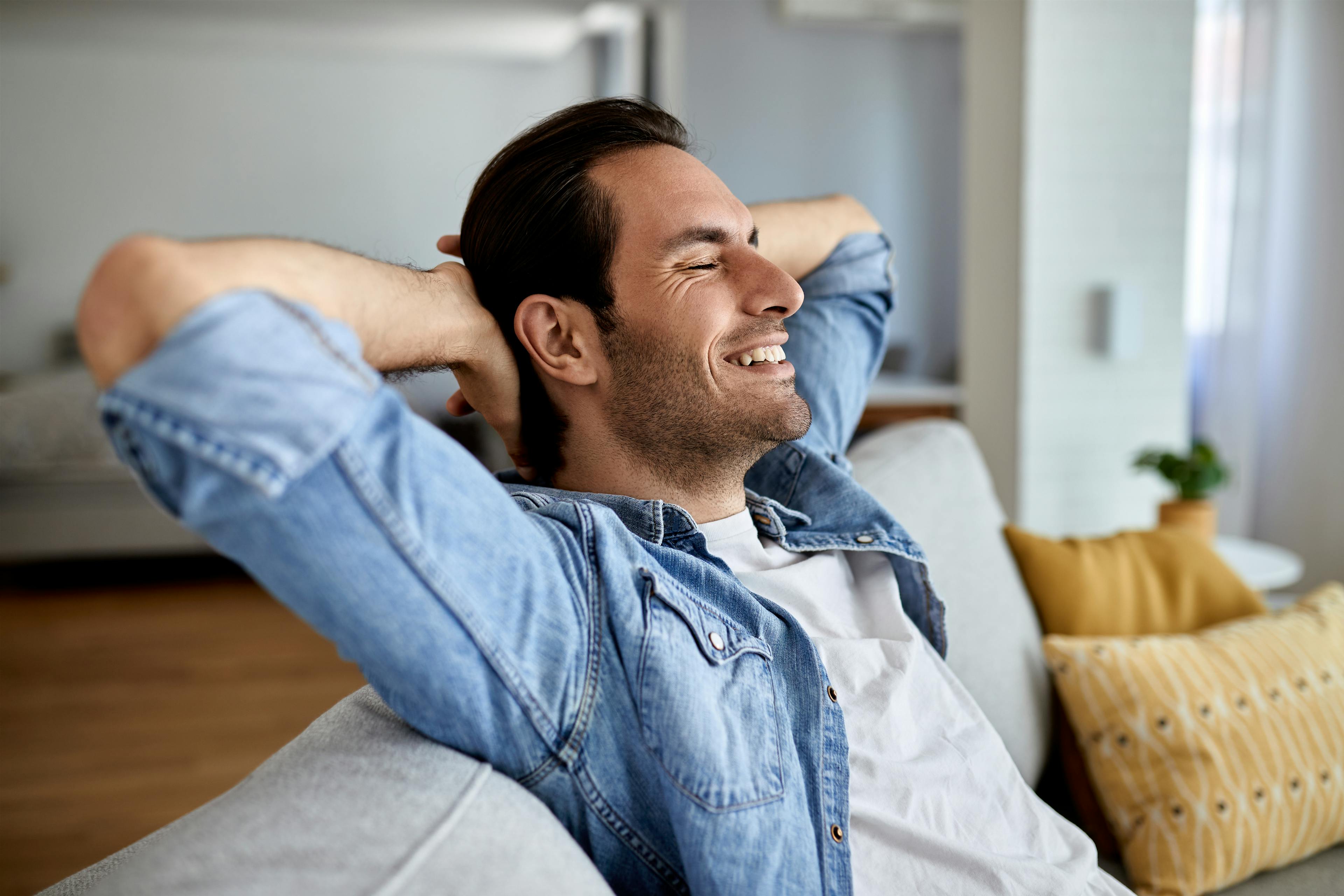 man happy on couch